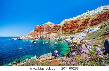 The old harbor of Ammoudi under the famous village of Ia at Santorini, Greece.