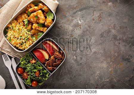 Lunch boxes with food ready to go for work or school, ahead meal preparation or dieting concept