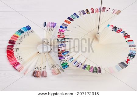 Nails art design samples. Manicure nail polish colors palette. Nails polish testers in different colors.