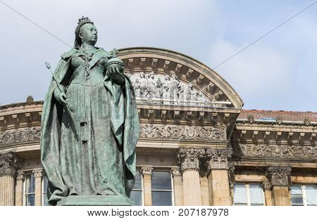 Birmingham, UK, October 3rd, 2017 : Statue of Queen Victoria in Birmingham, UK, Birmingham city council in the background.