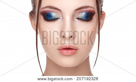 Closeup portrait of a beautiful young model with beautiful glamorous makeup the wet effect on her face and body eyelash removal procedure close up beautiful woman with long lashes