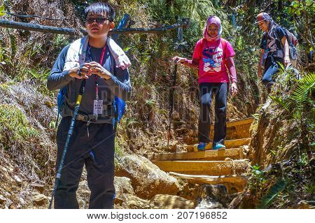Ranau,Sabah,Malaysia-March13,2016: Group of climbers move down from Laban Rata to Timpohon Gate at the Majestic Mount Kinabalu,Sabah.There are two new summit trails,Ranau Trail & Kota Belud Trail.