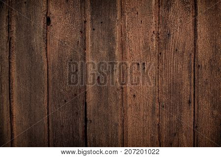 ark old wooden table texture backgroundNatural detailed plank photo texture. Texture in warm red and dark brown tones. Old wooden vintage background closeup for design with vignette