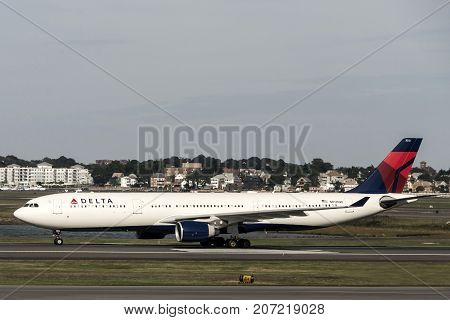 Boston, Massachusetts USA 23.09.2017 - Delta Airlines jet planes driving to terminal gates at Logan Airport