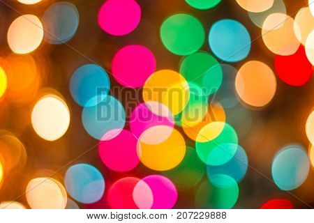 bokeh Decorative outdoor string lights hanging on tree in the garden at night time - decorative christmas lights - happy new year