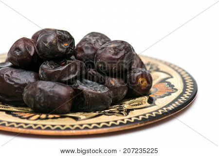 Fresh sweet dates on white background, close up