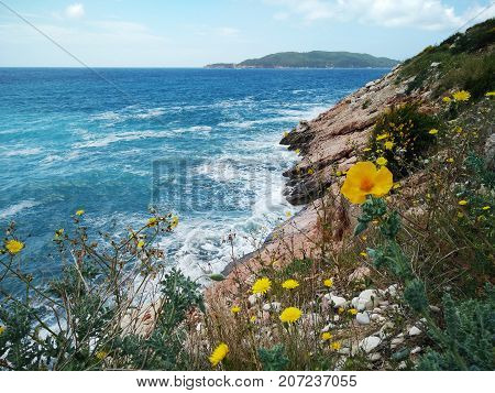 Landscape with foamy sea. view of sea waves hitting rocks on the beach in Montenegro. View of the Adriatic sea storm and coast range in Balkans Europe.