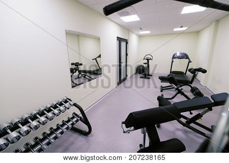 Small affordable home gym with fitness quipment