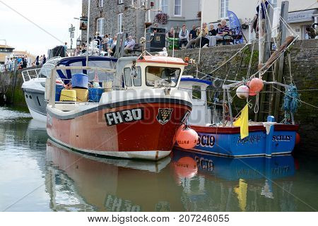 PADSTOW, UK - SEPTEMBER, 2 2017: Fishing and leisure boats moored in Padstow harbour, Padstow, Cornwall, UK