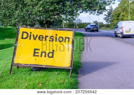 Diversion end sign on pedestrian footpath uk road.