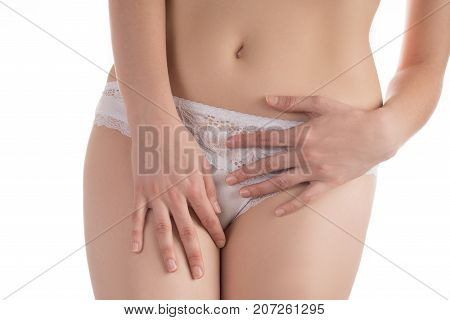 Girl in white shorts and a beautiful silhouette sexy stroking his stomach and seduces