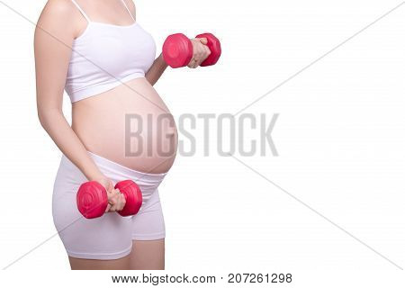 Pregnant exercises concept.A portrait of a Beautiful asian pregnant woman doing light exercise by using dumbbell isolated on white background with clipping path. Anonymous face Asia female in her 20s