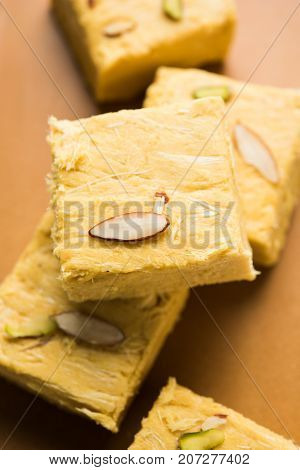 Stock photo of Soan Papdi or Soan roll or Patisa or patisha, popular sweet from India. selective focus