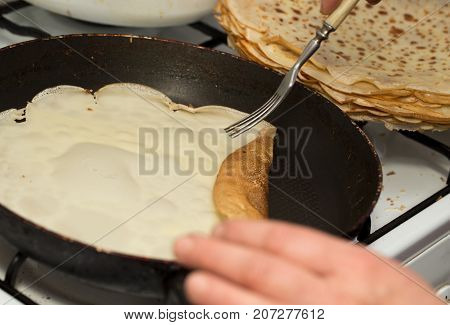 pancakes fried in a pan . Photos in the studio