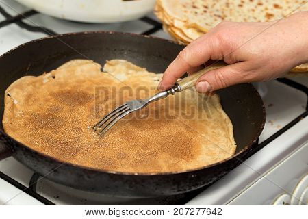 pancakes fried in a pan . Photos in the studio
