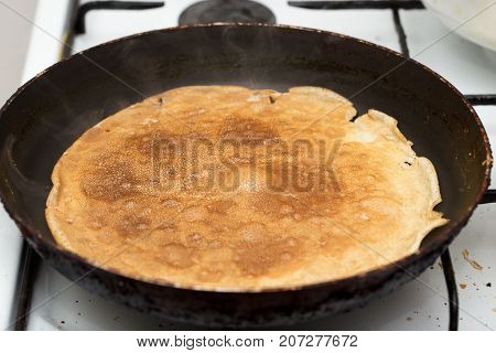 pancakes fried in a pan . Photos in the studio
