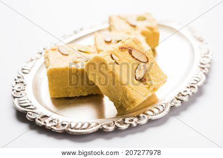 Stock photo of Soan Papdi or Soan roll or Patisa or patisha, popular sweet from India. selective focus