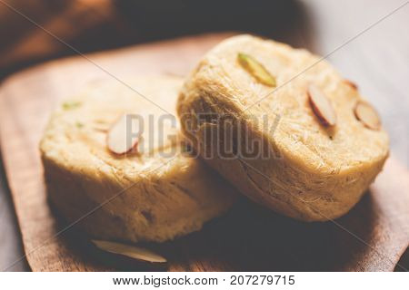 Stock photo of Soan Papdi or Soan roll or Patisa or patisha, popular sweet from India. selective focus