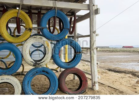Makeshift playground made from car tires next to Cambodian saltfields