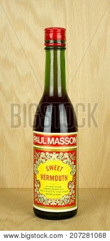 RIVER FALLS,WISCONSIN-OCTOBER 04,2017: A bottle of Paul Masson brand sweet vermouth with a wood background.