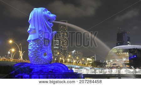 SIngapore - March 26 2017: Light projection on the Merlion statue during an art event. The Merlion is an imaginary creature with a lion head and the body of a fish and is seen as a symbol of Singapore
