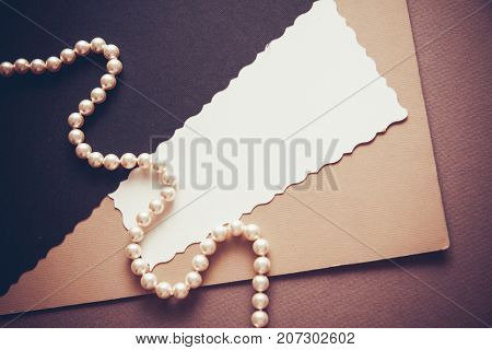 elegant background with dark neutral colors with brush feater and postcard