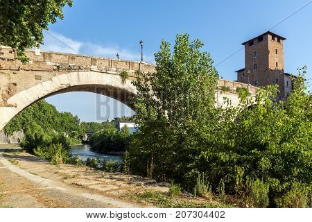 ROME, ITALY - JUNE 22, 2017: Amazing view of Castello Caetani, Tiber River and Pons Fabricius in city of Rome, Italy