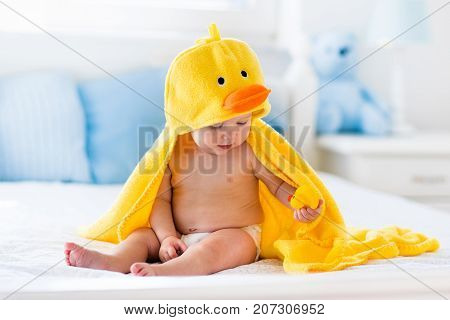 Cute Baby After Bath In Yellow Duck Towel