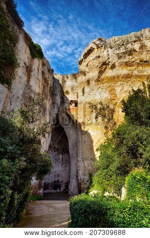 The entrance to the cavern known as the Orecchio di Dionisio (Ear of Dionysius) in the Archaeological Park in Syracuse, Sicily, Italy