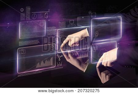 Male hands touching interactive table with purple cloudspace graphic on it 