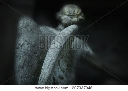 angel of death as a symbol of the end of life. Ancient statue. (Religion eternal life immortality faith concept)
