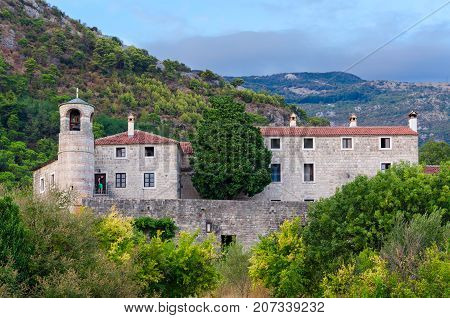 BUDVA MONTENEGRO - SEPTEMBER 7 2017: Unknown man is on territory of monastery Podmaine or Podostrog Budva Montenegro
