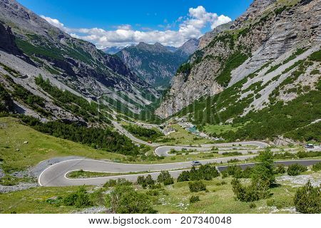 Top view of serpentine road and galleries of Stelvio Pass from above. Bormio side