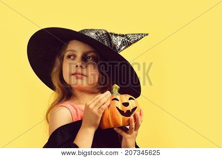 Kid In Black Witch Hat, Dress And Tricky Face