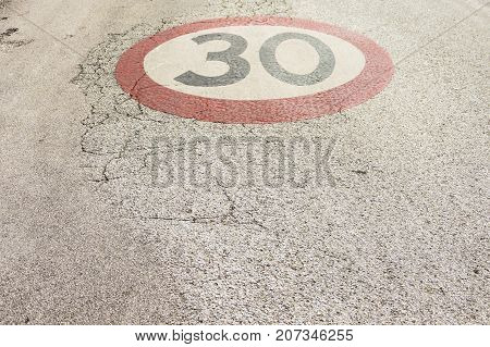 Color image on street of a 30km/h speed restriction