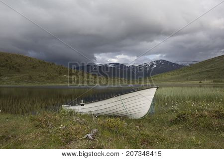 Boat In Front Of A River In Jotunheimen Norway