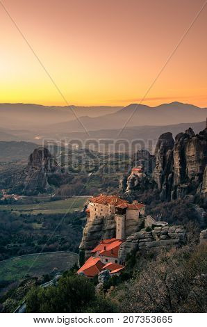 Breathtaking view of Meteora at sunset, Greece. Geological formations of big rocks with Monasteries  on top of them.
