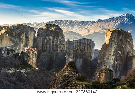 Breathtaking view of Meteora at sunset, Greece. Geological formations of big rocks with Monasteries on top of them.