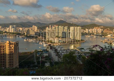Sanya, China - April 07, 2017: Evening view of Sanya from the top of a hill in a Luhuitou Park