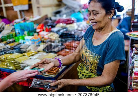 Bali, Indonesia - August 30, 2013: Pasar Kumbasari Morning market, flowers, fruit and vegetable market. Ubud, Bali, Indonesia