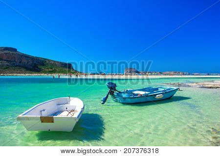 Amazing view of Balos Lagoon with magical turquoise waters, lagoons, tropical beaches of pure white sand and Gramvousa island on Crete, Greece