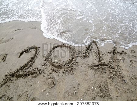 Year 2017 On The Sand Of The Sea Waiting To Be Canceled By The W