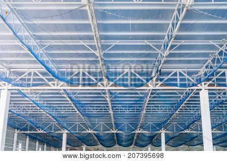 Structure of steel roof frame and metal sheet in building construction site