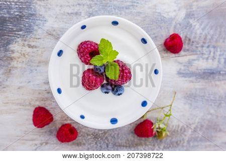 A bowl of healthy and delicious yogurt with fresh berry fruits.