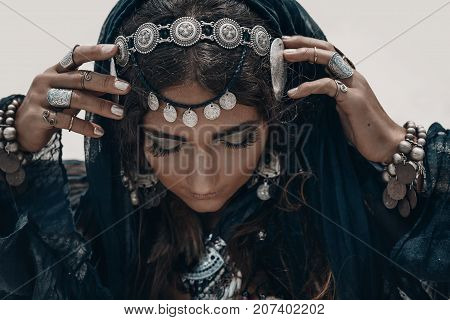 close up of beautiful tribal woman. Hands of ethnic dancer. Soft focus
