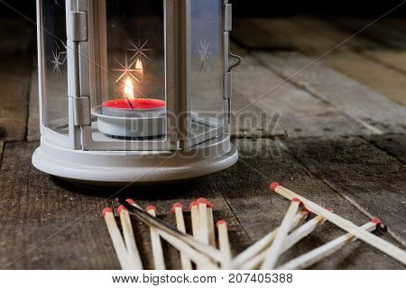Two Small Lanterns On A Wooden Table. Candle In Old Latarence. Wooden Table.