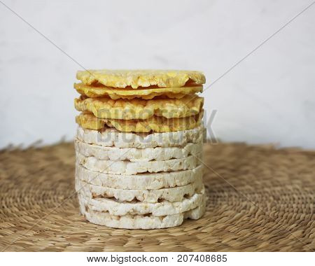 White rice crackers on whicker place mat background.