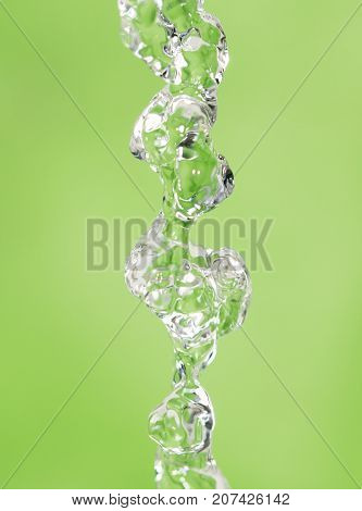 a jet of water on a green background