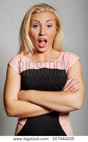The portrait of attractive suprised woman in studio.