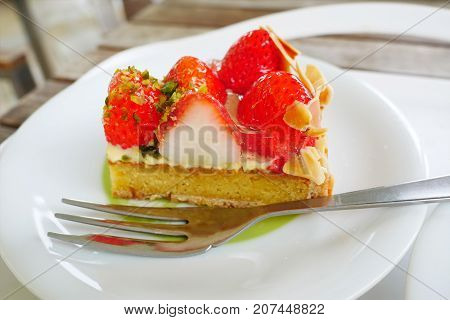 Close up japanese strawberry tart on white plate background. Popular favorite japan sweet dessert.